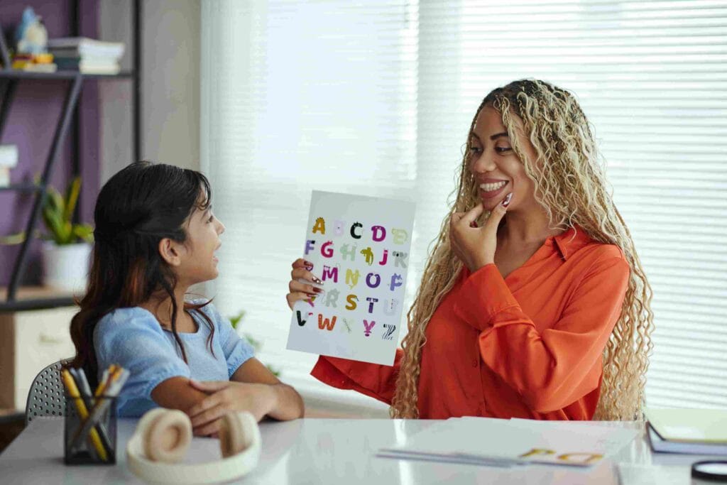 Transform Your Child's Confidence: 9 Powerful Strategies for Verbal Dyslexia Success Section 3 teacher spelling alphabetical to a girl with verbal dyslexia